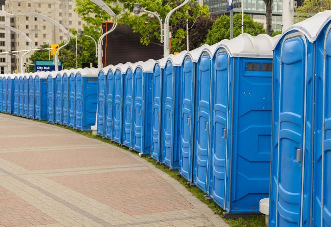 multiple portable restrooms in a neat and tidy row in Melvindale